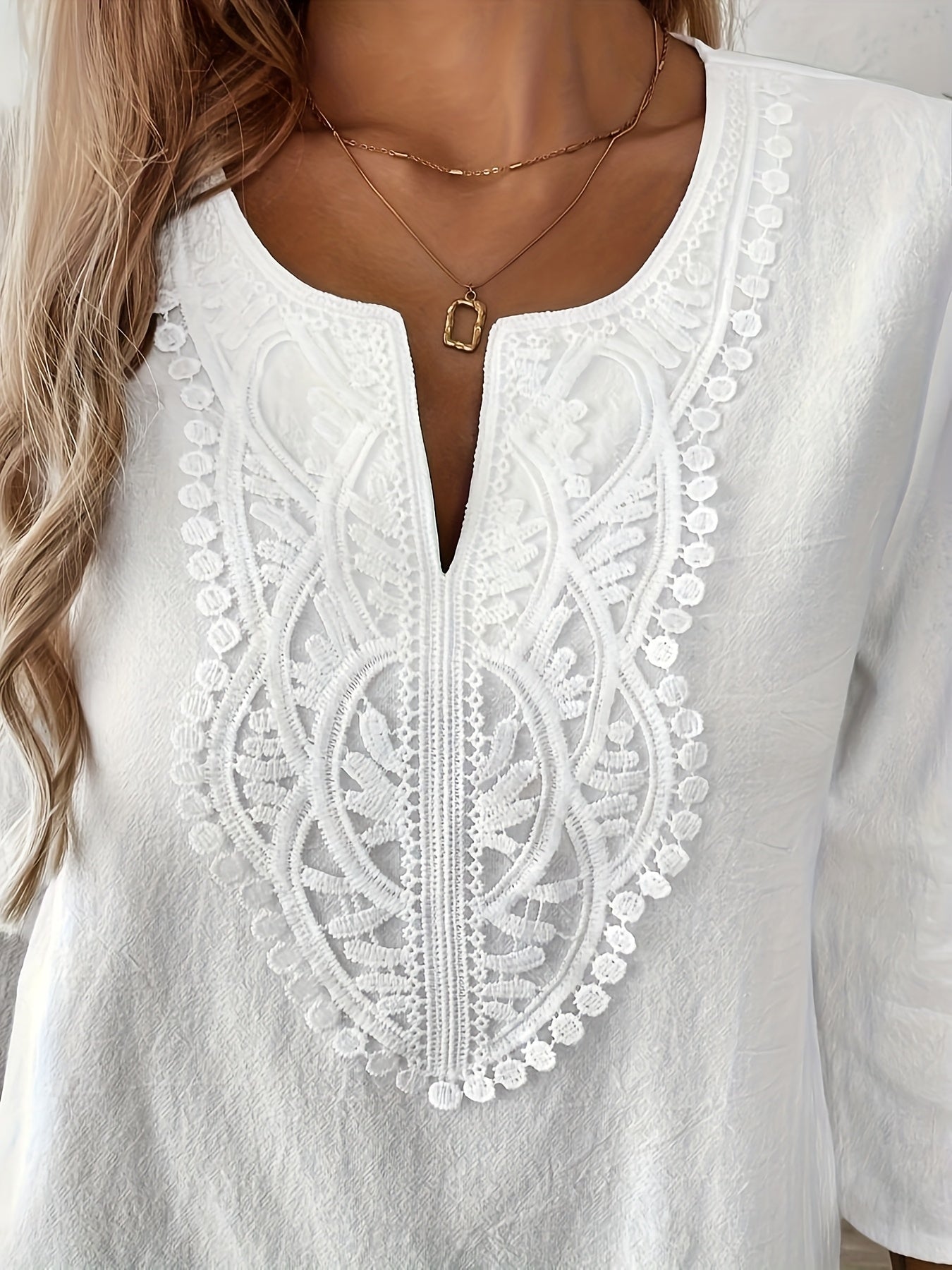 Women's bohemian chic style blouse with long sleeves and embroidery for an elegant casual look