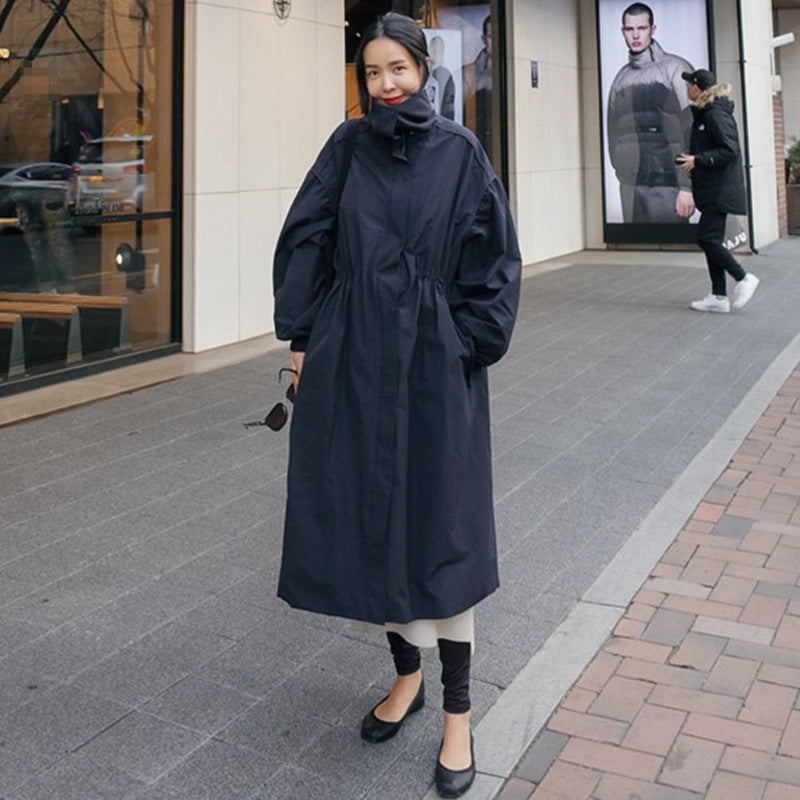 Women's loose-fit long navy blue coat with a waist drawstring