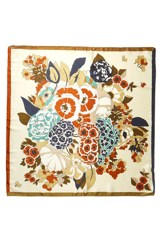 Square scarf with a floral pattern, bright colors, and a contrasting border