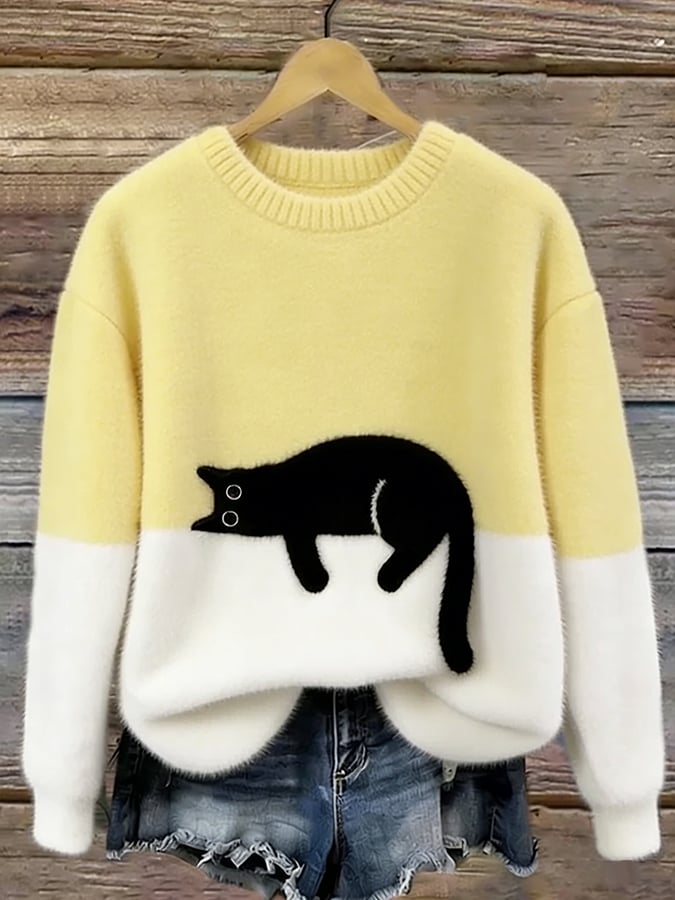 Cozy two-tone sweater with black cat motif, long sleeves and crew neck