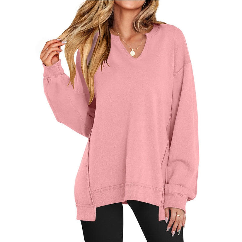 Svart sweatshirt för dam med V-ringning, långa ärmar och sidoslitsar