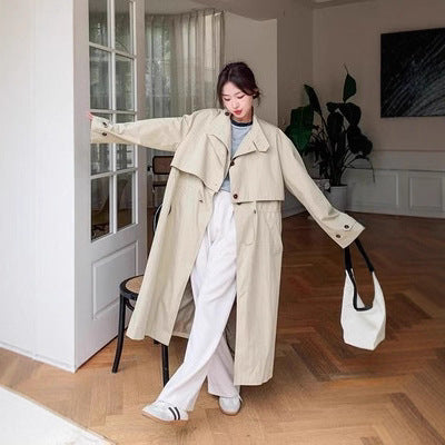 Trench-coat long beige femme à col montant et taille ajustable