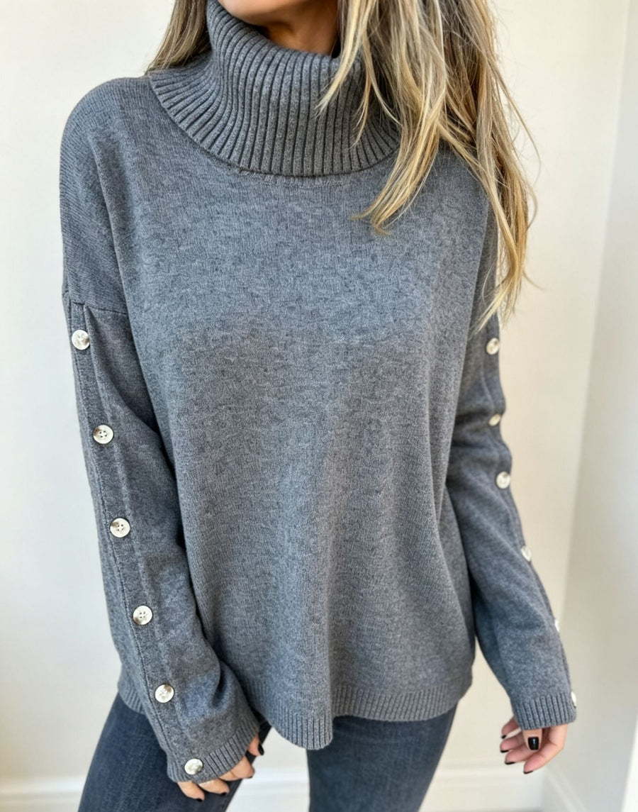Jersey de cuello alto beige para mujer con botones decorativos en las mangas