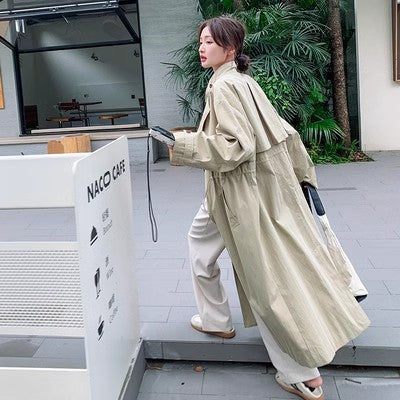 Trench-coat long beige femme à col montant et taille ajustable