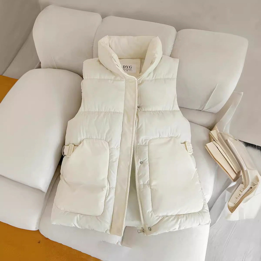 Solid-color quilted puffer vest with a stand collar and side flap pockets