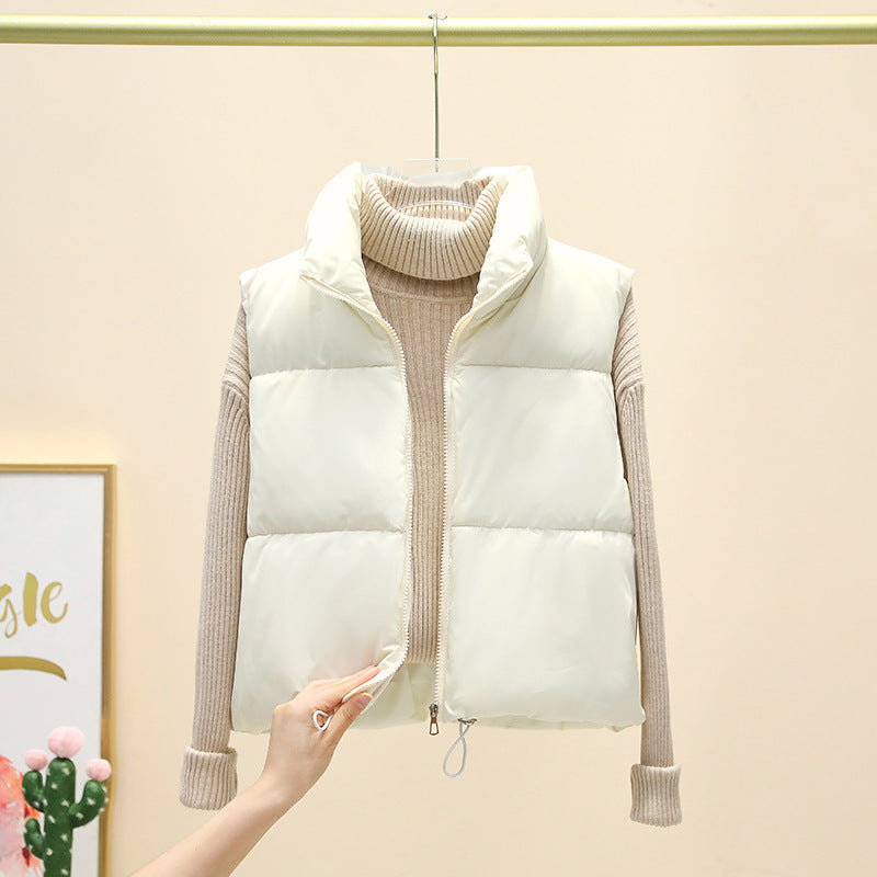 Korte doorgestikte damesbodywarmer zonder mouwen met ritssluiting