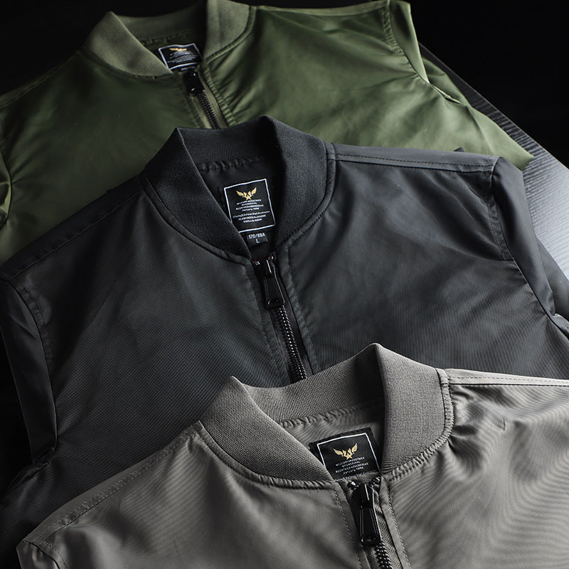 Men's solid-color bomber jacket with zippered pockets