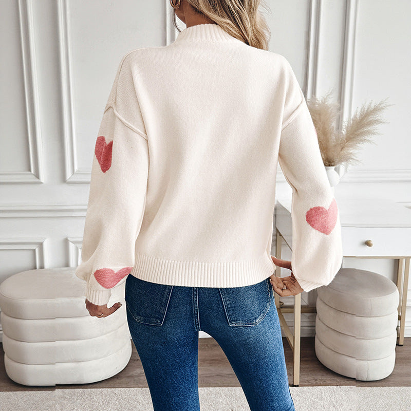 Pull col montant crème à cœurs roses pour femme
