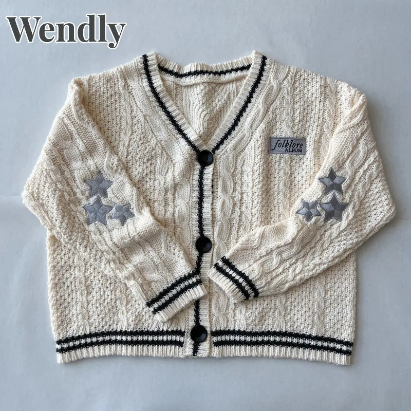 Cardigan tricoté crème rayé noir avec étoiles brodées