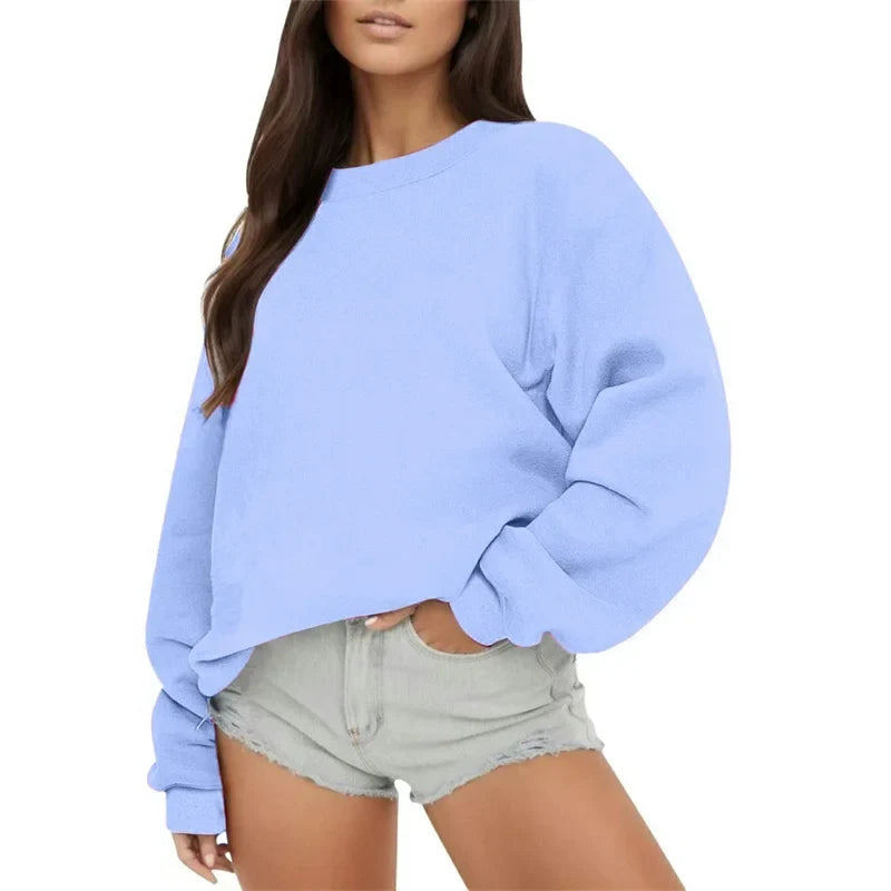 Ensfarvet, løstsiddende sweatshirt til kvinder med rund hals og lange ærmer