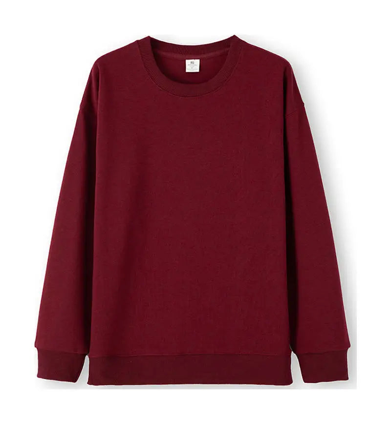 Avslappnad unisex sweatshirt med rund hals, långa ärmar och enfärgad design