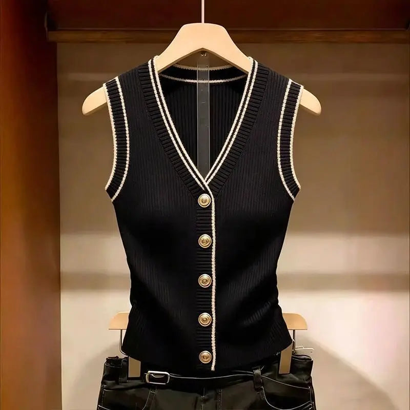Giletto da donna nero a coste senza maniche con scollo a V, righe bianche e bottoni dorati