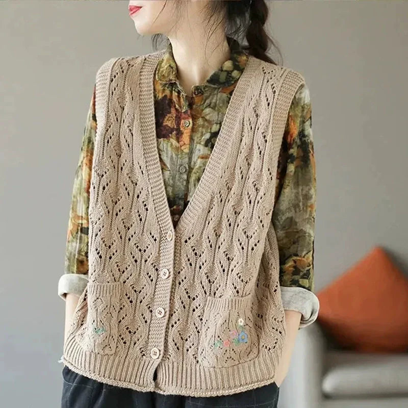 Women's open-knit sleeveless vest with V-neck, buttons, and floral embroidery