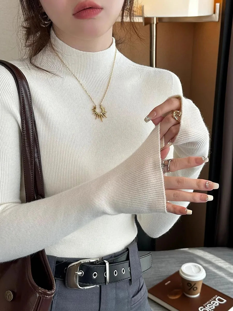 Suéter de mujer de cuello alto acanalado y manga larga con abertura para el pulgar, de color liso