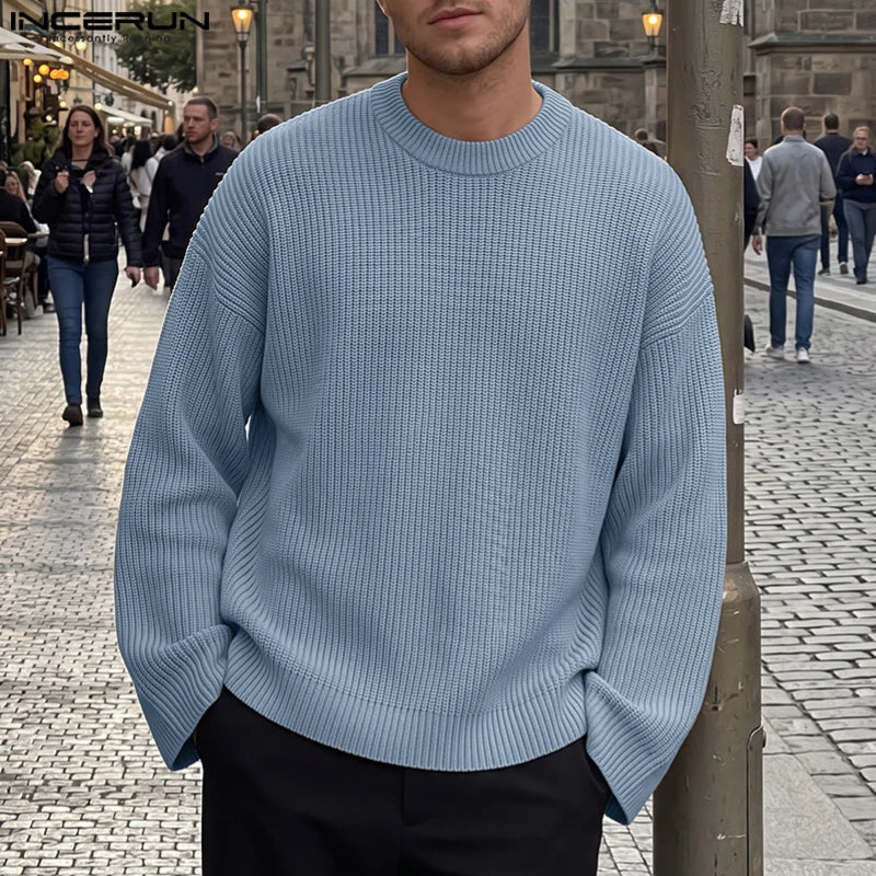 Men's loose-fit black ribbed crew-neck sweater with long sleeves