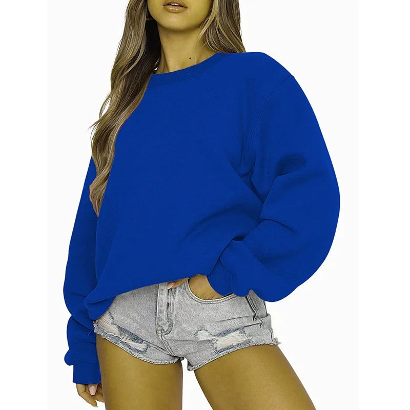 Ensfarvet, løstsiddende sweatshirt til kvinder med rund hals og lange ærmer
