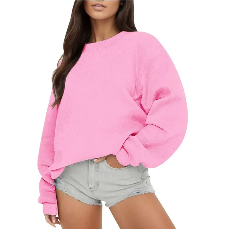 Ensfarvet, løstsiddende sweatshirt til kvinder med rund hals og lange ærmer