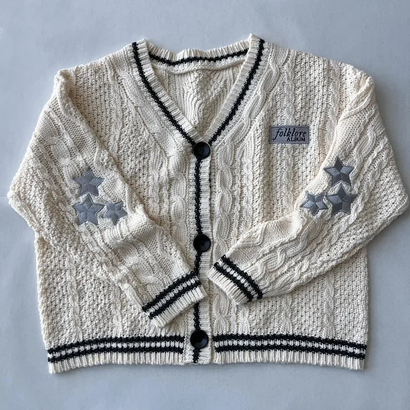 Cardigan tricoté crème rayé noir avec étoiles brodées