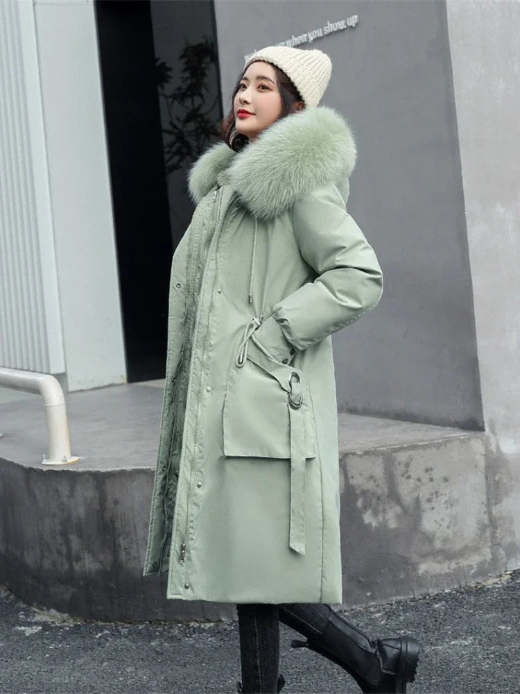 Women's long quilted parka coat with a faux-fur-trimmed hood and removable lining