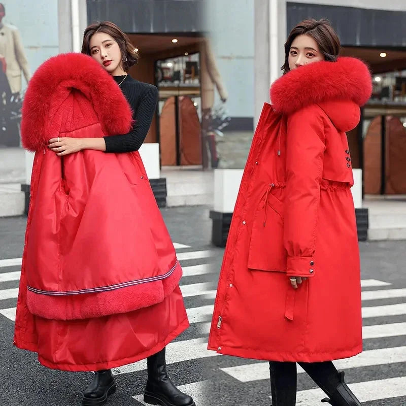 Women's long quilted parka coat with a faux-fur-trimmed hood and removable lining