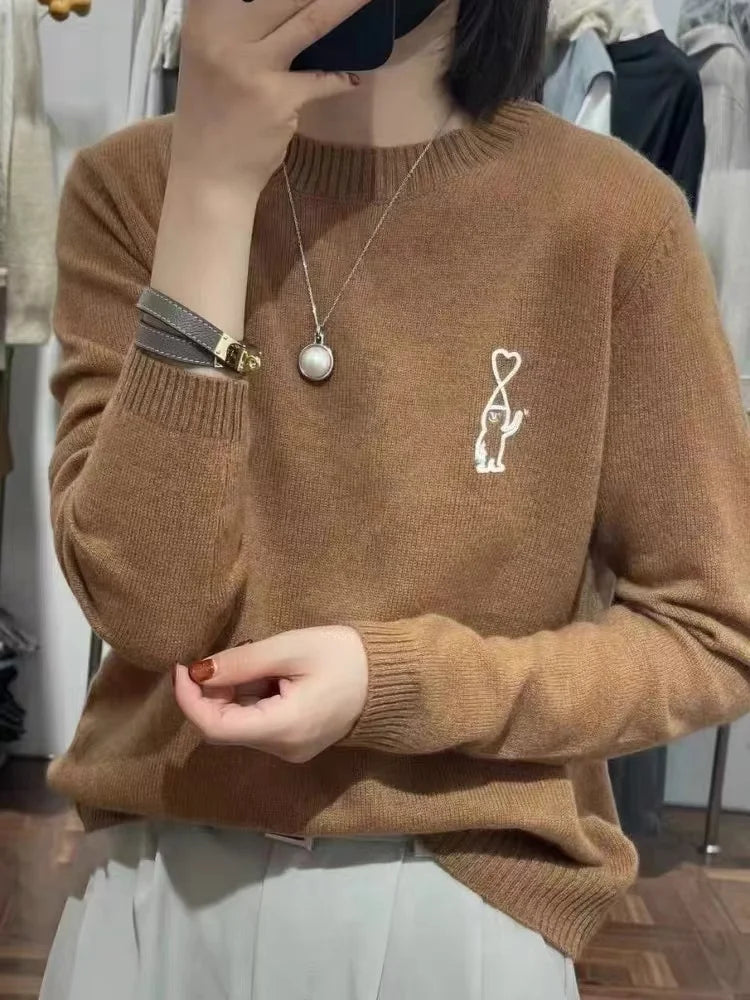 Maglione da donna con collo rotondo, motivo ricamato e colori a tinta unita