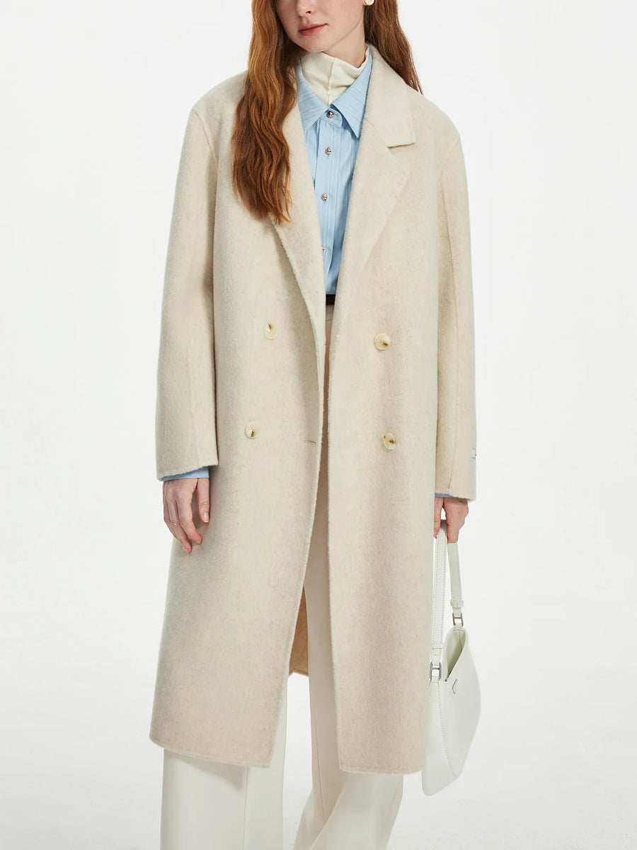 Women's straight-cut, double-breasted wrap coat in a solid color