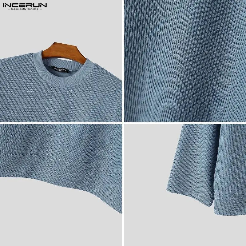 Men's loose-fit black ribbed crew-neck sweater with long sleeves