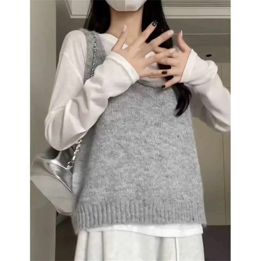 Women's open-knit sleeveless vest with V-neck, buttons, and floral embroidery