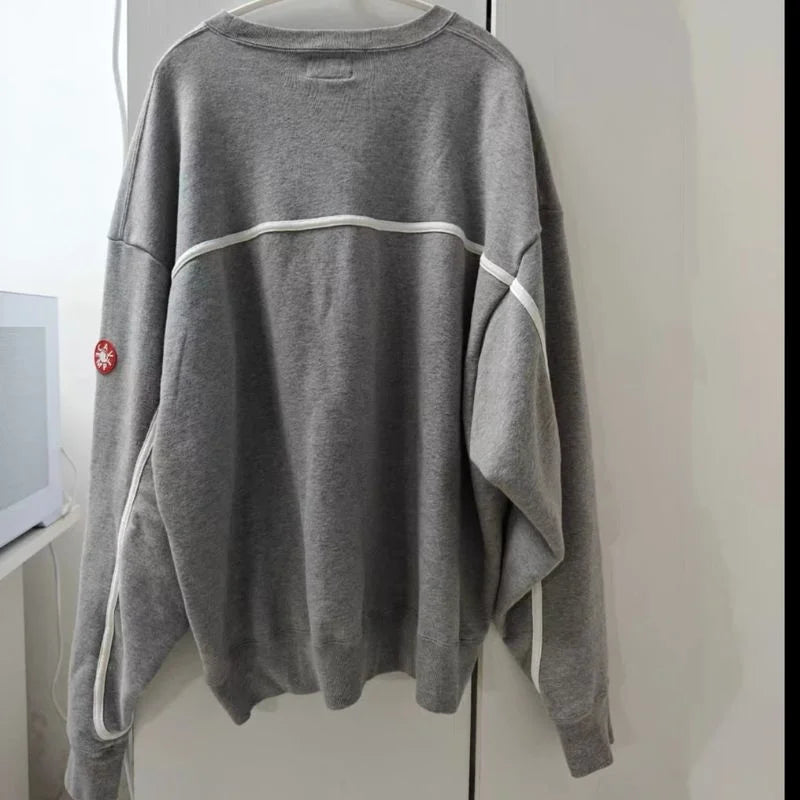 Unisex crew-neck sweatshirt with a graphic design, available in several colors and sizes