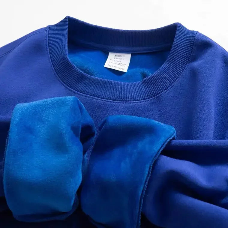 Sweat-shirt col rond doublure douce aspect peluche couleur unie