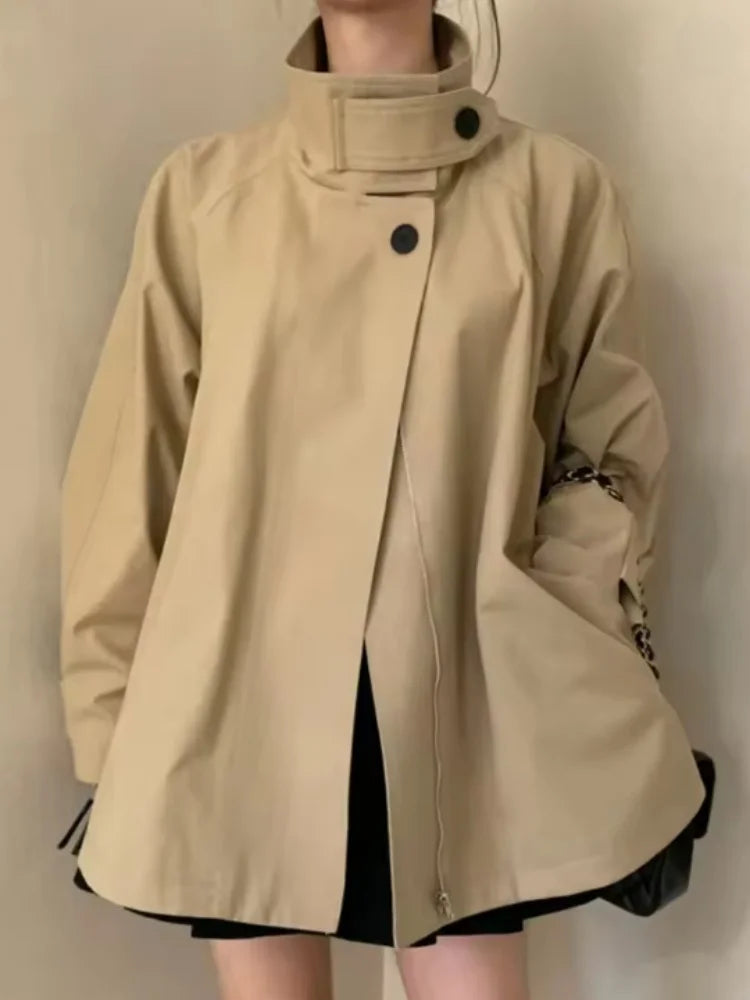 Loose-fitting mid-length women's jacket with stand-up collar, buttons, and hood