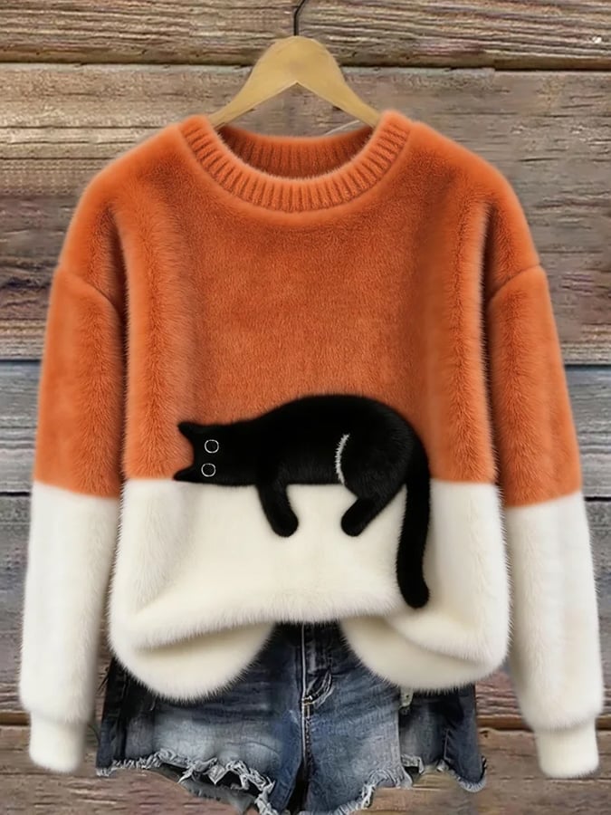 Cozy two-tone sweater with black cat motif, long sleeves and crew neck