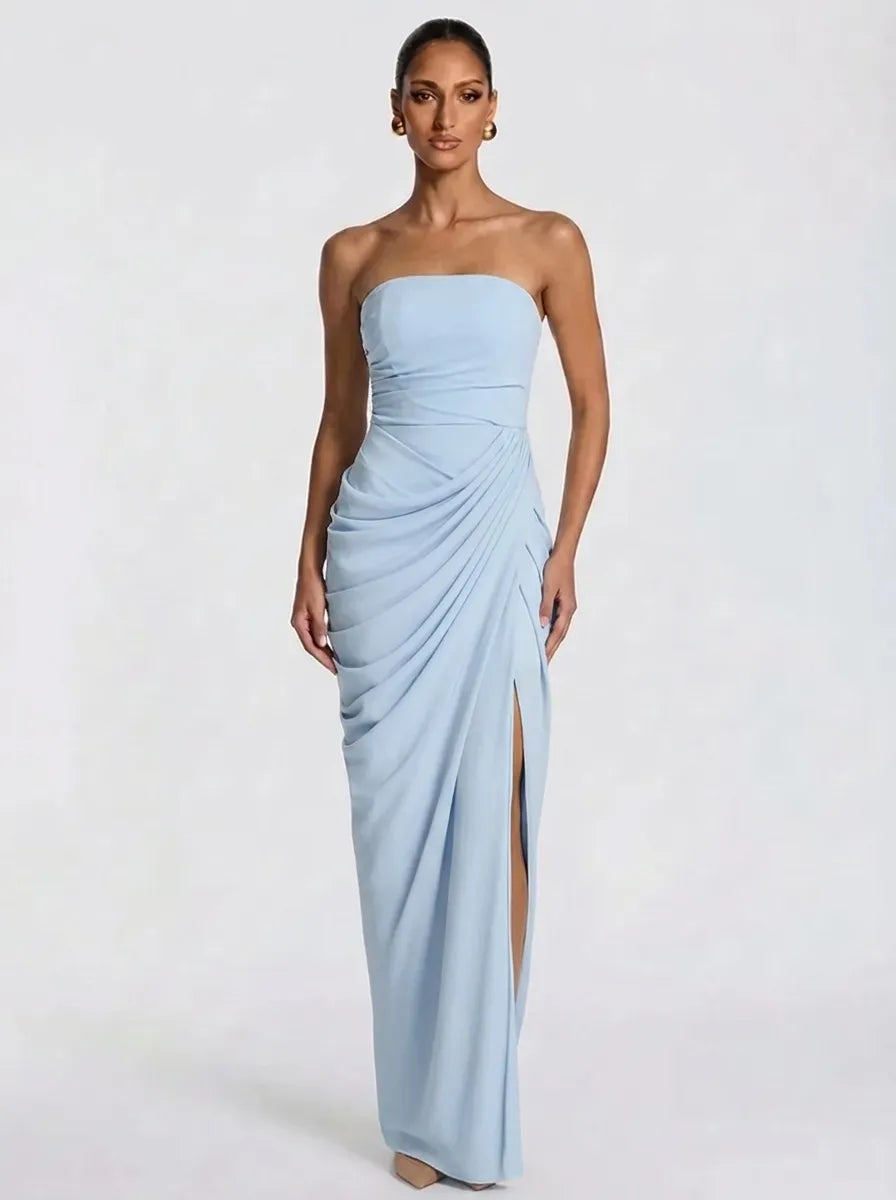 Women's pale yellow strapless pleated maxi dress with a slit
