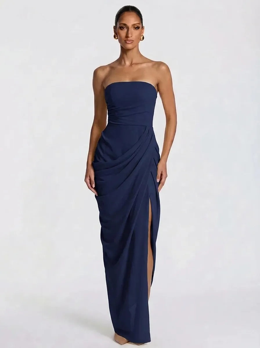 Women's pale yellow strapless pleated maxi dress with a slit