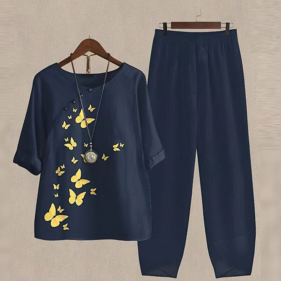 Damen-Zweiteiler aus Bluse und weiter Hose mit gelb-orangefarbenem Blätterprint
