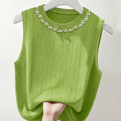 Elegante dames mouwloze top met parelmoerlook en ronde hals, geschikt voor uitgaan of kantoor