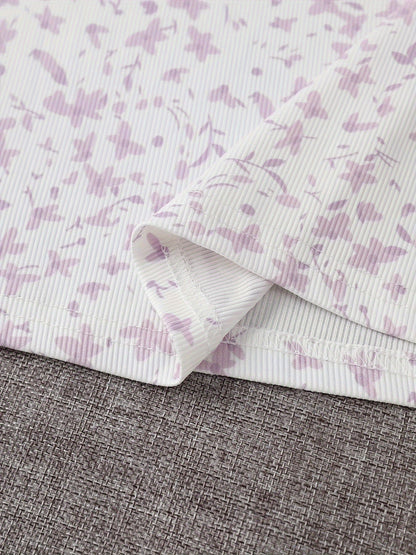 Abito floreale elegante con bolero annodato da donna, outfit chic per primavera ed estate