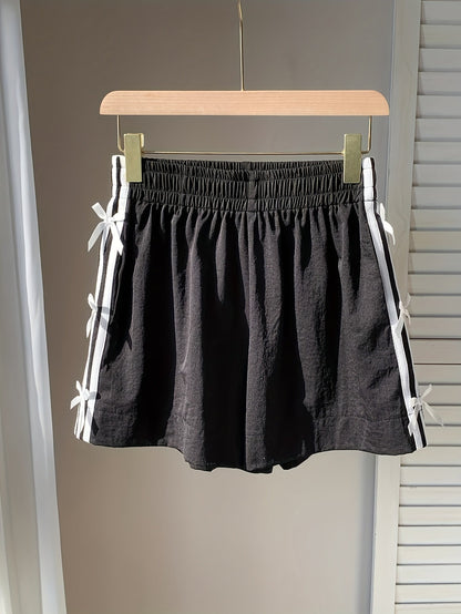 Short décontracté femme style vacances avec nœuds latéraux et bandes sportives
