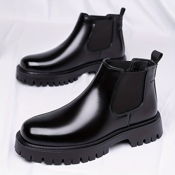 Men's low black Chelsea boots with lug soles, classic ankle-boot style