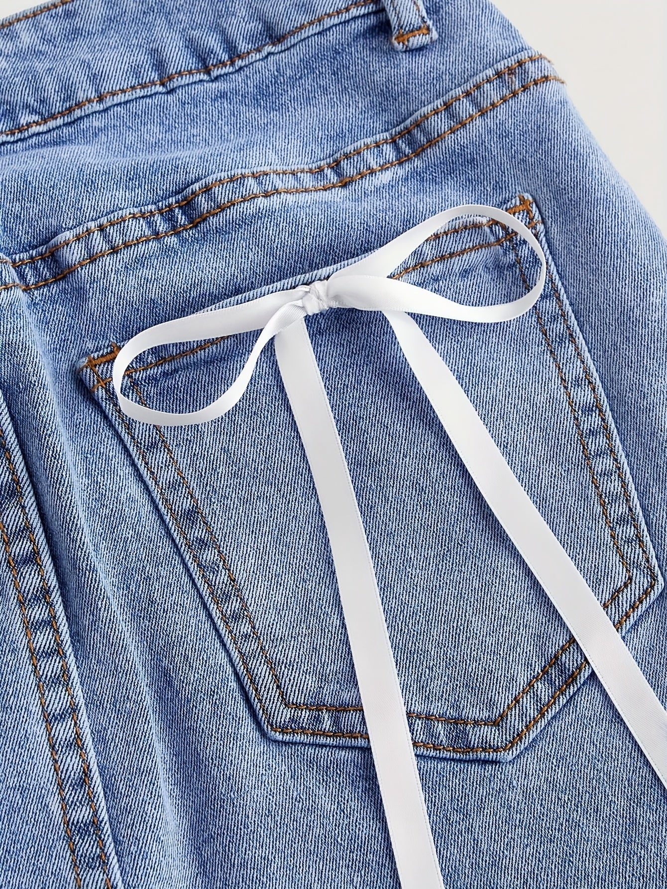 Short denim skirt with decorative bows for women, elegant and casual style