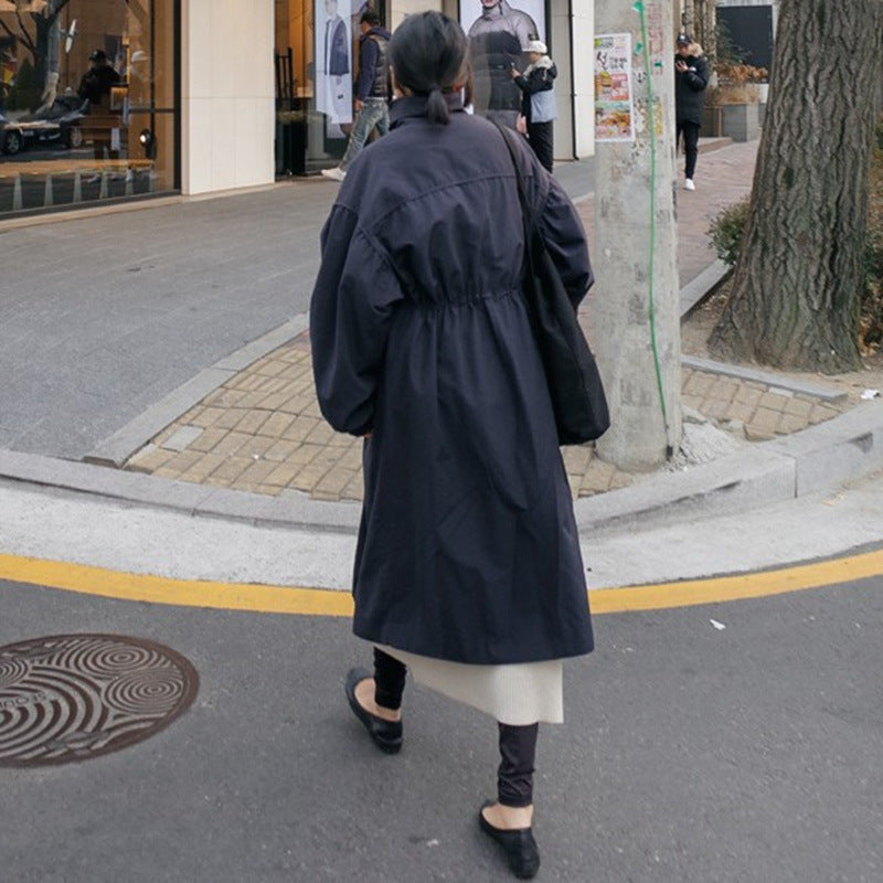 Women's loose-fit long navy blue coat with a waist drawstring