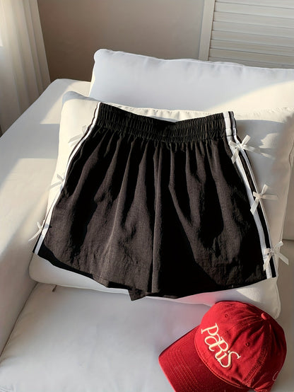 Short décontracté femme style vacances avec nœuds latéraux et bandes sportives