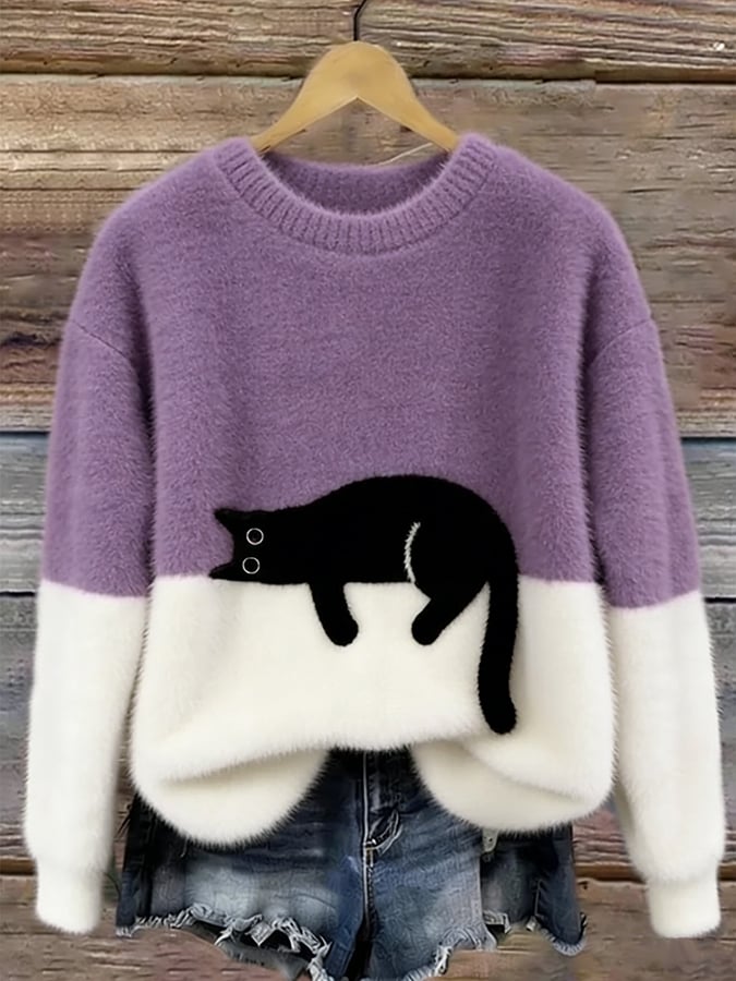 Cozy two-tone sweater with black cat motif, long sleeves and crew neck