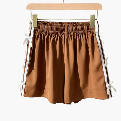 Short décontracté femme style vacances avec nœuds latéraux et bandes sportives