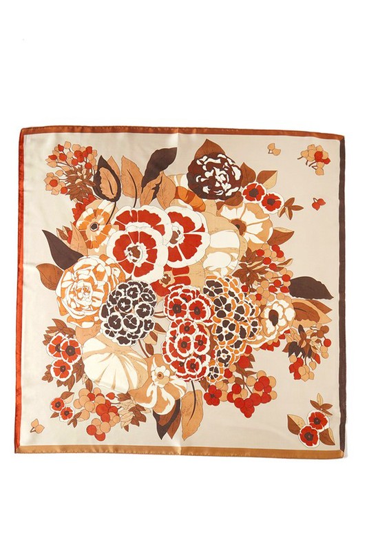 Square scarf with a floral pattern, bright colors, and a contrasting border