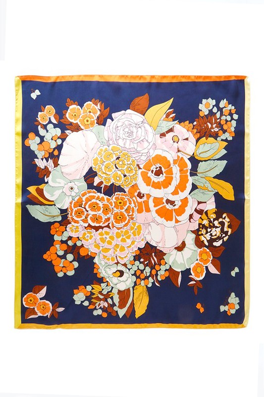 Square scarf with a floral pattern, bright colors, and a contrasting border
