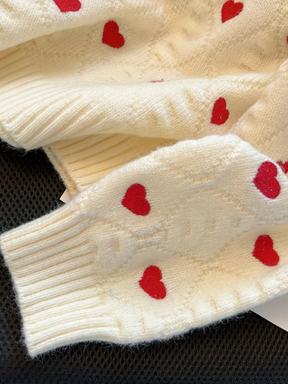 Pull femme crème à cœurs rouges, col montant, maille texturée