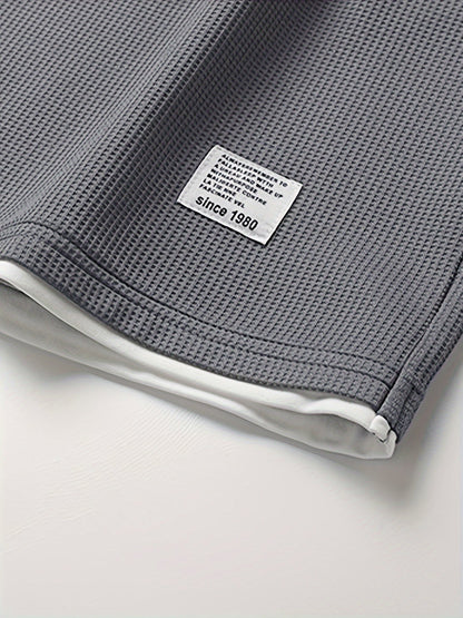 Completo uomo informale due pezzi maglietta larga e pantaloncini stile urbano ideale per relax e uscite