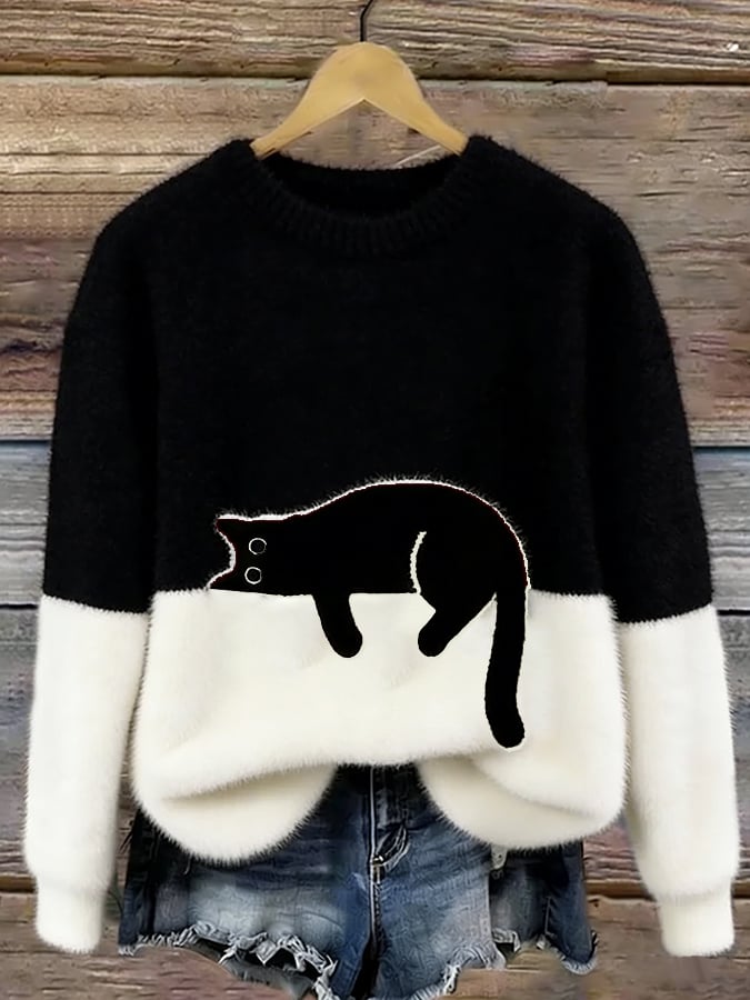 Cozy two-tone sweater with black cat motif, long sleeves and crew neck