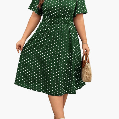 Elegancka sukienka damska w groszki w stylu lat 50. Rozkloszowana na lato